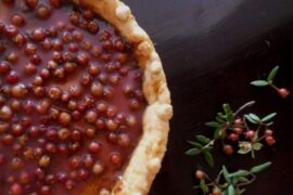 Chilean murta kuchen with a crisp shortcrust base filled with pastry cream and fresh murtilla berries