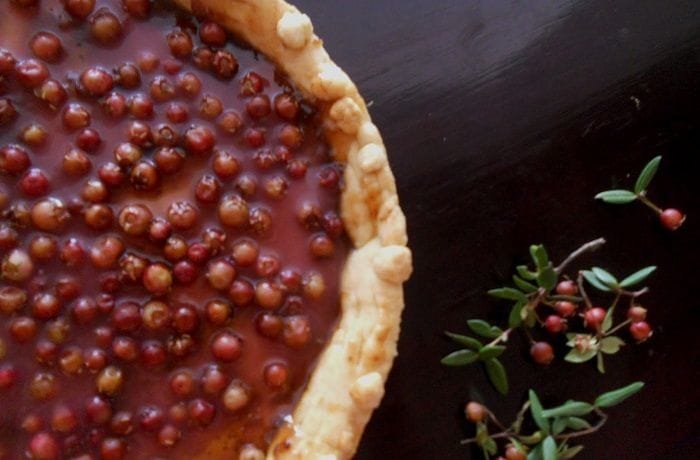 Chilean murta kuchen with a crisp shortcrust base filled with pastry cream and fresh murtilla berries