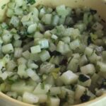 Chilean nalca pebre with diced nalca stalk, cilantro, and merken in a bowl