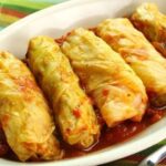 Chilean ninos envueltos, cabbage rolls stuffed with ground beef and rice in tomato sauce