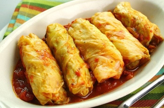 Chilean ninos envueltos, cabbage rolls stuffed with ground beef and rice in tomato sauce