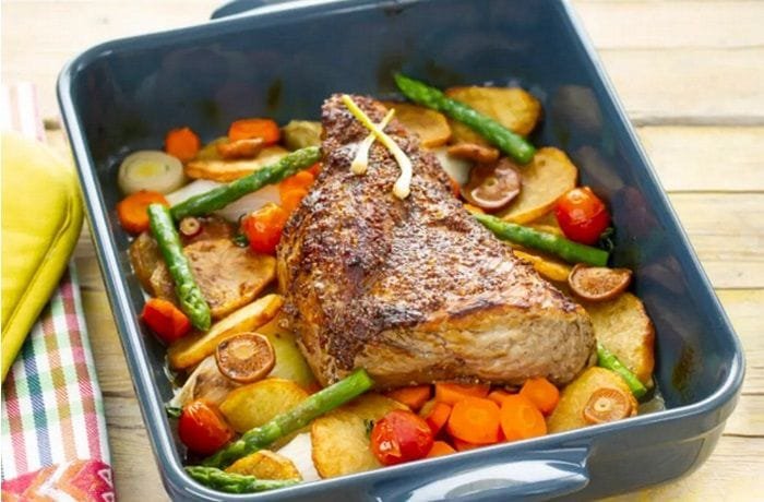 Chilean oven roast beef sliced with golden potatoes, onions, and red peppers