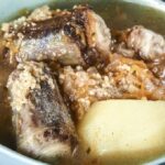 Chilean oxtail and cracked wheat soup with vegetables and whole potatoes