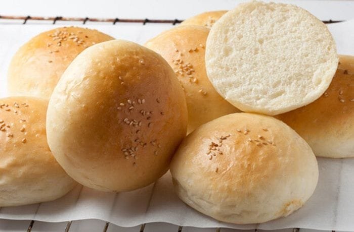 Chilean pan frica burger buns sprinkled with sesame seeds