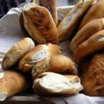Chilean pan minero de Lota, kneaded bread with a golden crisp crust, served in a basket