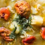 Chilean pancutras, flour dumplings in a broth with piures and vegetables