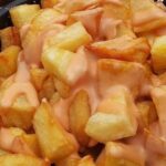 Chilean papas bravas, chopped and browned potatoes bathed in a creamy merken sauce.