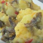 Papas con luche: rustic mashed potatoes cooked with luche seaweed (Pyropia columbina) and a vegetable saute.