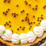 Chilled passion fruit pie with golden Italian meringue and passion fruit seeds