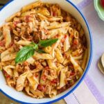 Chilean pasta with canned jack mackerel tomato sauce topped with parsley
