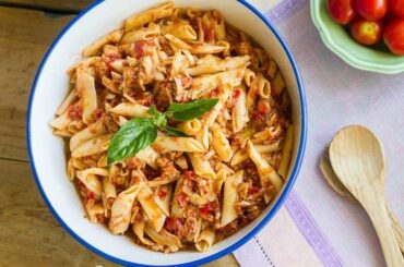 Chilean pasta with canned jack mackerel tomato sauce topped with parsley
