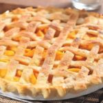 Freshly baked Chilean peach kuchen with pastry cream and golden peach slices