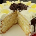 Chilean pineapple and cream layer cake with coconut on the sides