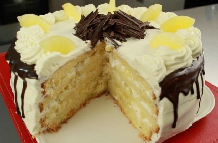 Chilean pineapple and cream layer cake with coconut on the sides