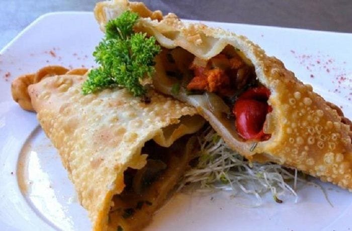 Golden, crisp fried Chilean piure empanadas filled with sea squirt and onion