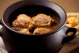 Chilean pollo al conac, flambeed chicken in a white wine and cognac sauce, a traditional dish.
