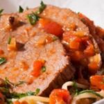 Chilean pollo ganso a la olla, eye of round pot roast served in slices with carrots and thick gravy