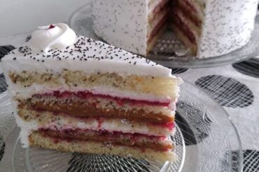Chilean poppy seed cake layered with manjar, cream, and jam and topped with walnuts
