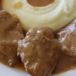 Chilean pork tenderloin braised in the pot, sliced into medallions with vegetable sauce and rice