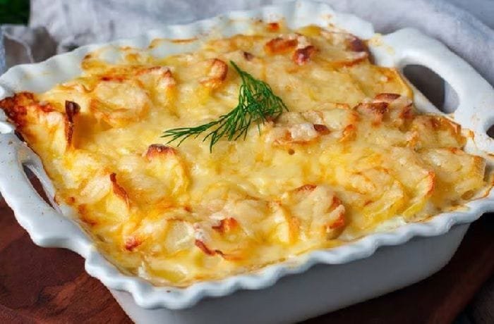Potatoes au gratin with layers of cream and golden Parmesan