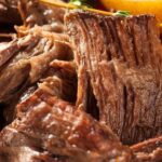 Beef brisket stewed in its own sauce in a pressure cooker, ready to serve.