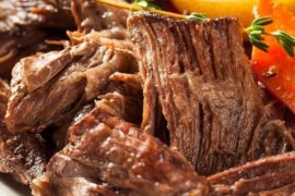 Beef brisket stewed in its own sauce in a pressure cooker, ready to serve.