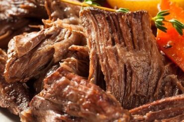 Beef brisket stewed in its own sauce in a pressure cooker, ready to serve.