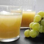 Bottle of Chilean pronto alivio, a pale yellow grape and aguardiente digestif, with white grapes
