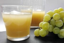 Bottle of Chilean pronto alivio, a pale yellow grape and aguardiente digestif, with white grapes