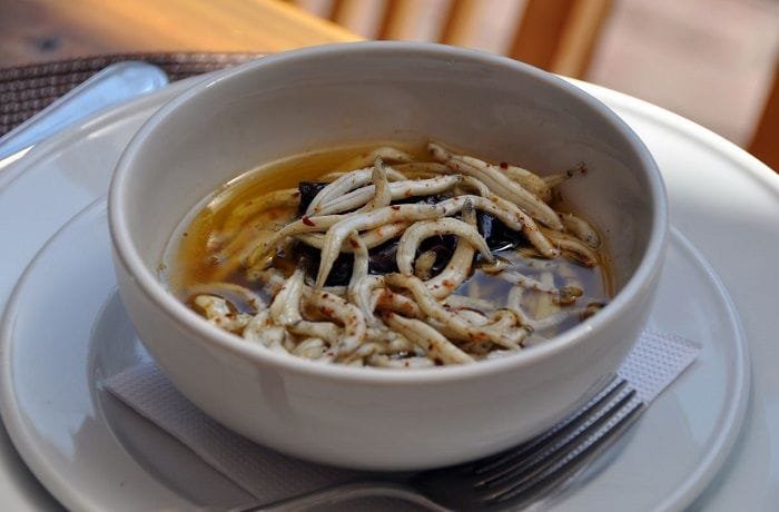 Chilean puyes, tiny translucent fish sautéed in olive oil with merkén and parsley