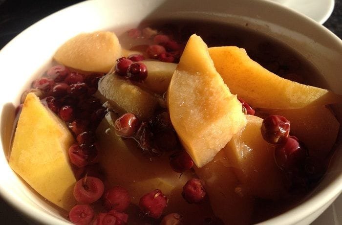 Ripe yellow quinces, whole and cut into wedges, for the quince and murta preserve