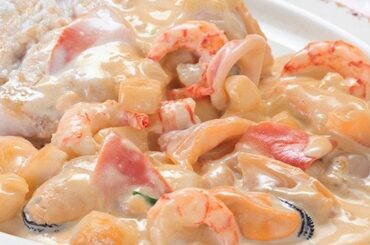 Chilean salsa margarita, a creamy seafood sauce with shrimp, mussels, clams, and squid