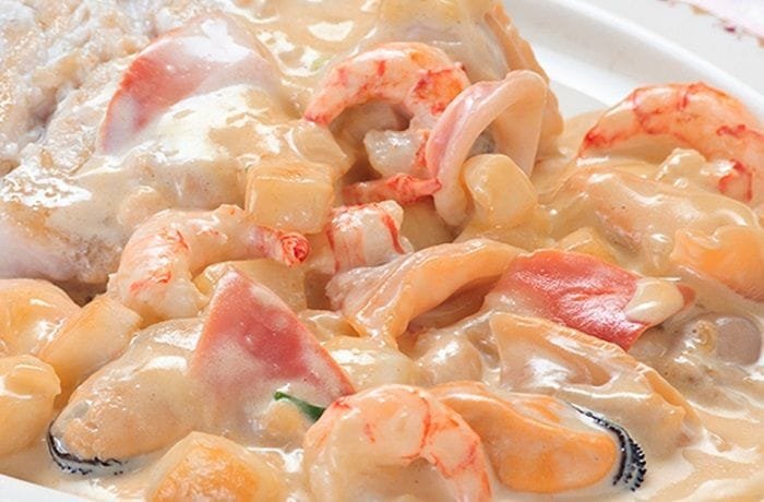 Chilean salsa margarita, a creamy seafood sauce with shrimp, mussels, clams, and squid