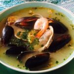 Chilean caldillo de mariscos with clams, mussels, and shrimp in fish broth