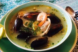 Chilean caldillo de mariscos with clams, mussels, and shrimp in fish broth