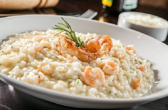 Creamy shrimp risotto with parmesan, garnished with parsley