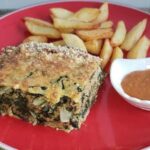Homemade Chilean Swiss chard budin, baked golden with grated cheese on top