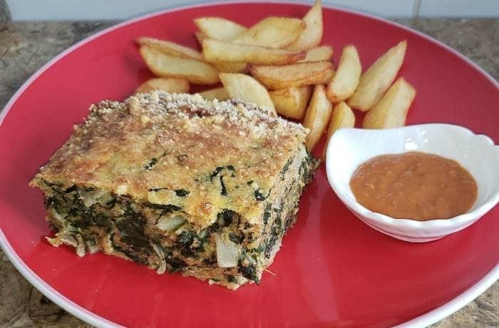Homemade Chilean Swiss chard budin, baked golden with grated cheese on top