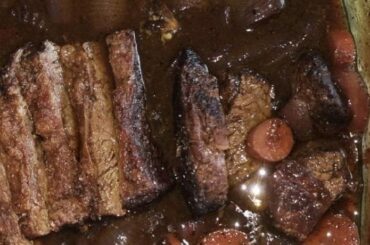 Chilean beef tapapecho slow roasted in red wine sauce, tender and glossy after hours in the oven.