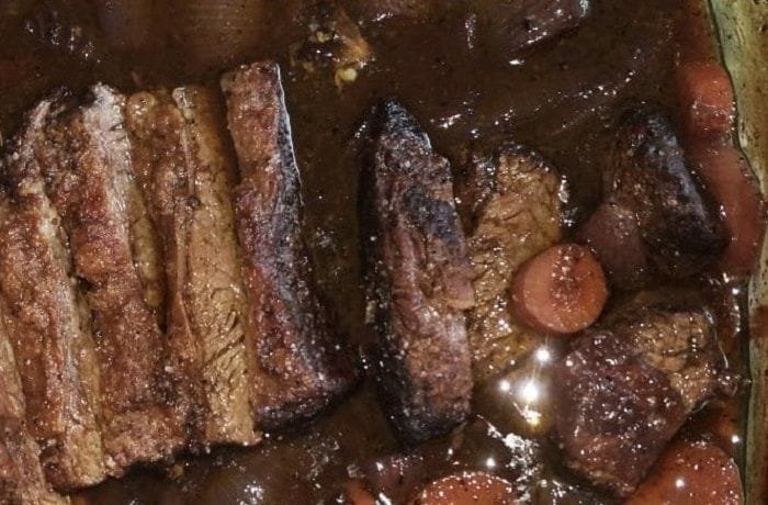 Chilean beef tapapecho slow roasted in red wine sauce, tender and glossy after hours in the oven.