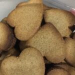 Chilean harina tostada cookies, golden and crisp, dusted with powdered sugar