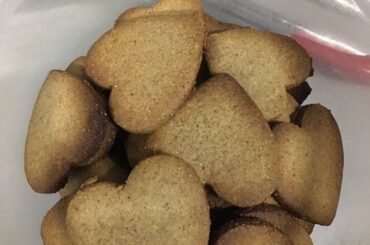 Chilean harina tostada cookies, golden and crisp, dusted with powdered sugar