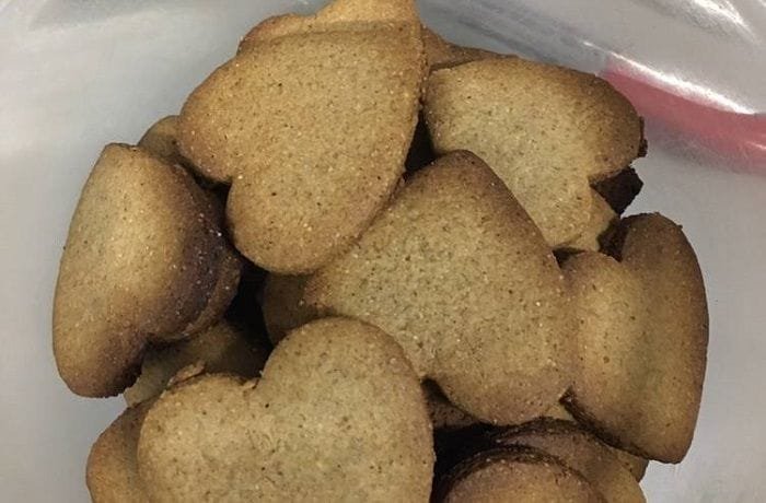 Chilean harina tostada cookies, golden and crisp, dusted with powdered sugar