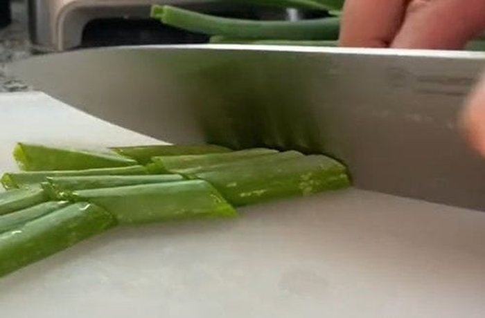 Fresh scallions chopped into small pieces, ready to sauté and add to the mayonnaise.