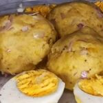Colombian cabeza de gato, mashed green plantain balls with cheese and egg