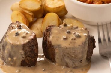 Creamy morel mushroom sauce served over a cut of meat
