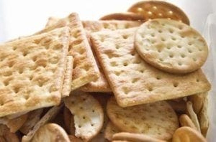 Crushed soda crackers ready to form the layers of the no-bake Chilean cracker cake