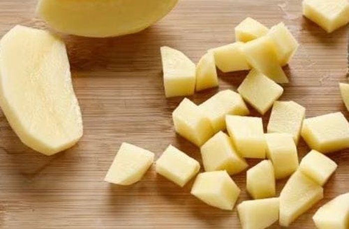 Peeled, diced potatoes, part of the vegetables in the soup.