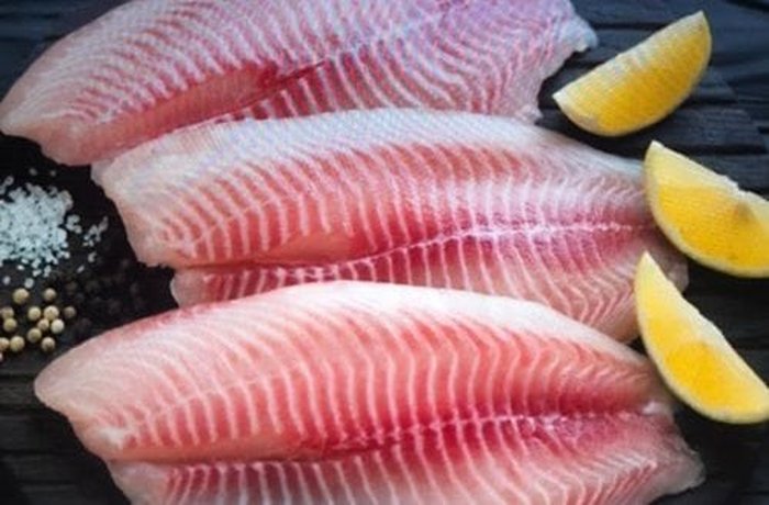 Fresh reineta fish cut into cubes, ready to be marinated in lime juice for the mariscal.