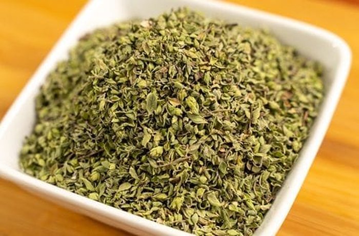 Dried oregano to flavor the garlic breadstick dough